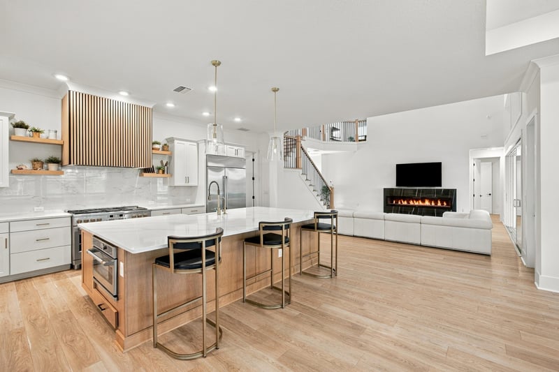 Kitchen open to the great room with fireplace at 907 Seagrove Dr, Ponte Vedra Beach, FL 32081