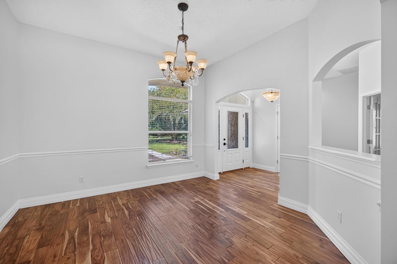 Formal room with arched doorway and wood floors at 11675 Magnolia Estates Rd, Jacksonville, FL 32223