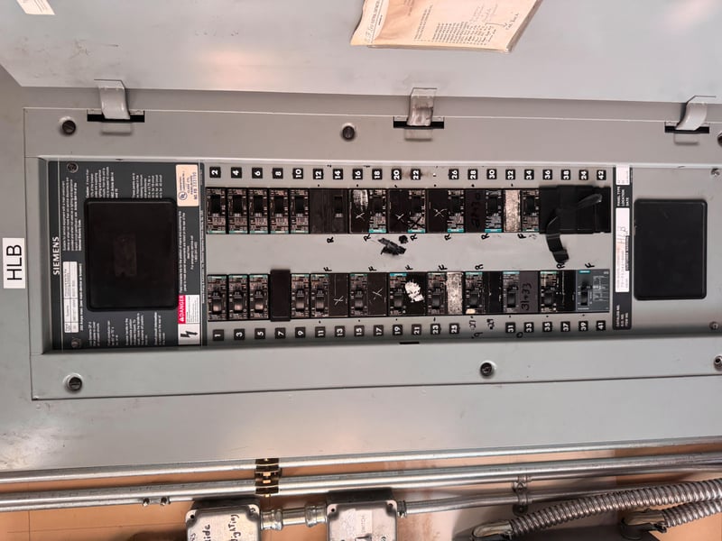 Open panel with rows of circuit breakers at 11700 New Kings Rd, Jacksonville, FL 32219