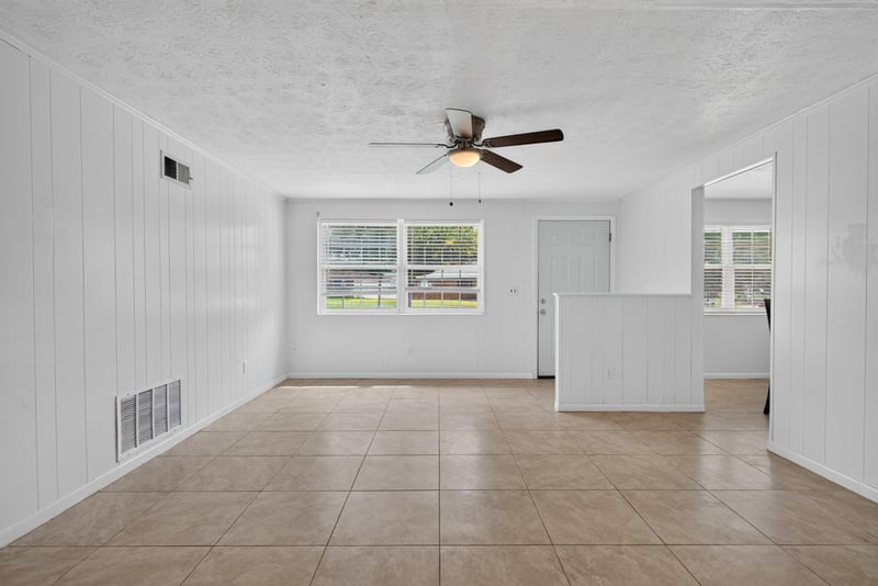 Living room with ceiling fan and tile flooring at 9954 Larkdale Ct, Jacksonville, FL 32257