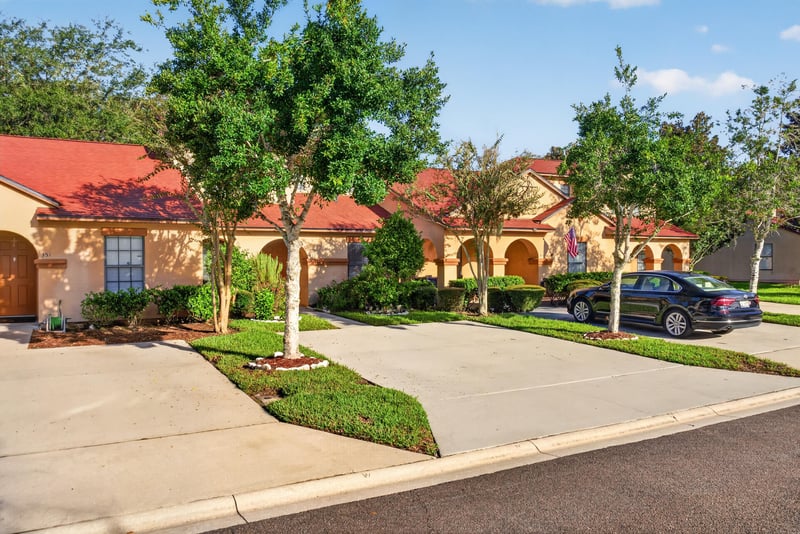 Front exterior with driveway and parked cars at 353 Redwood Ln