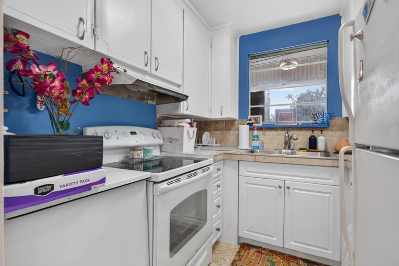 Kitchen with stove and window view at 5745 110th St, Jacksonville, FL 32244