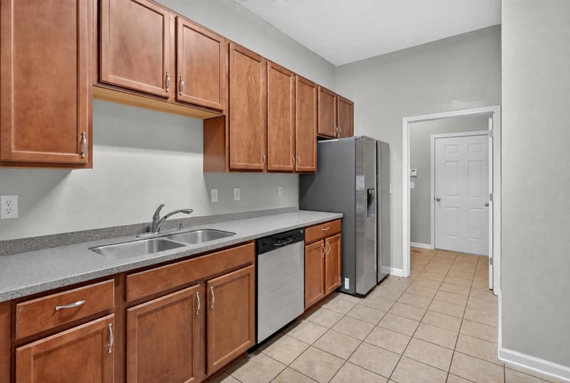 Kitchen with stainless microwave and tile backsplash at 8196 Cabin Lake Cir, Jacksonville, FL 32256