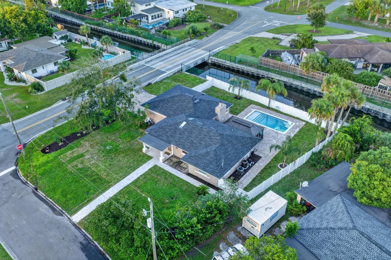 Aerial view of the home and pool from above at 1525 8th St N, Jacksonville Beach, FL