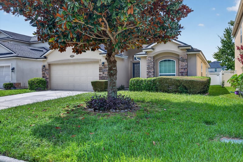 Front exterior with landscaped tree at 469 Glendale Ln, Orange Park, FL