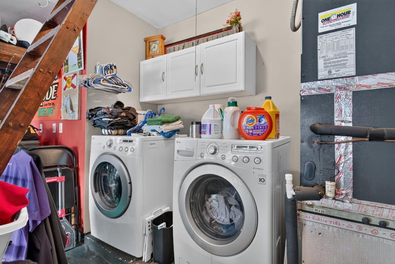 Garage with washer, dryer and shelving at 13020 Medford Ln, Jacksonville, FL 32225