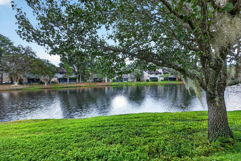 Pond and lawn view near the building at 3801 Crown Point Rd, Jacksonville, FL 32257