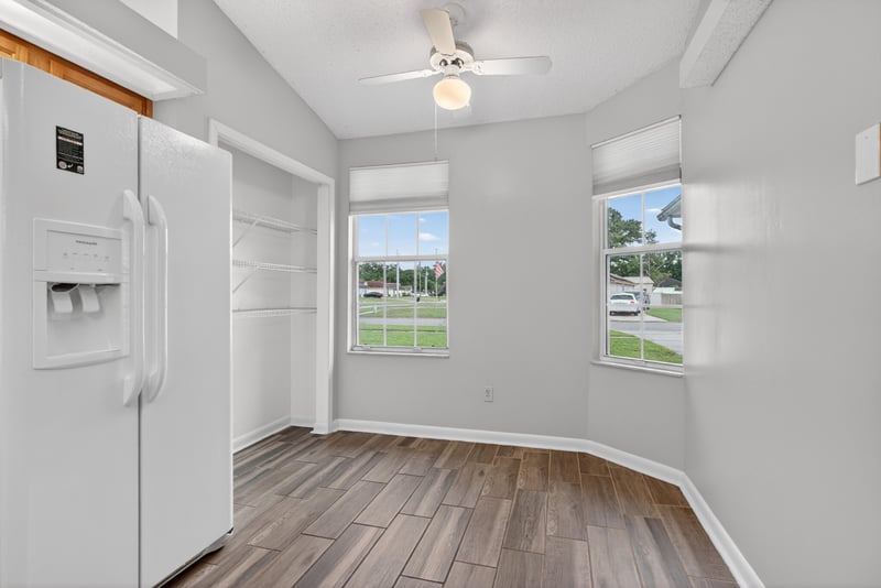 Kitchen with white refrigerator and windows at 2164 Orangewood St, Middleburg, FL 32068