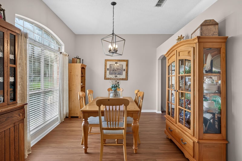 Dining room with wood table and china cabinet at 13514 Las Brisas Way N, Jacksonville, FL