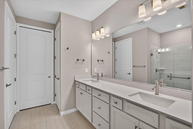 Bathroom with double-sink vanity and white cabinets at 171 Oyster Shell Ter, Nocatee, FL 32081