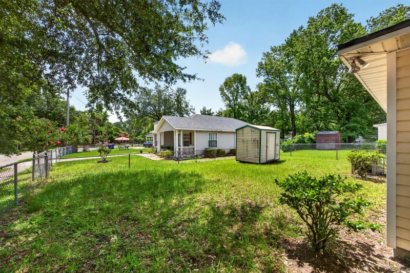 Backyard with storage shed and open lawn at 5375 Dodge Rd, Jacksonville, FL 32209