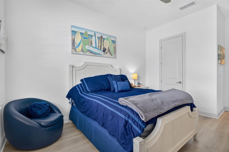 Secondary bedroom with upholstered headboard at 785 Back Creek Dr, St. Augustine, FL 32092