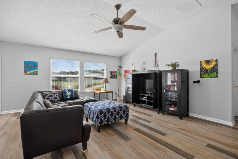 Living room with sofa and bookshelf at 2065 Creekmont Dr