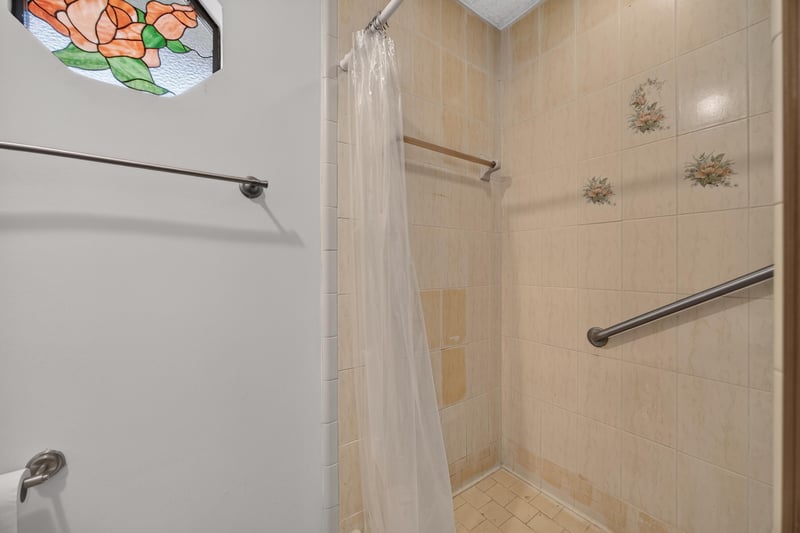 Shower stall with stained glass window and grab bar at 2460 San Sago Ln, Jacksonville, FL