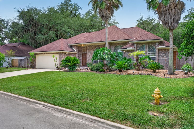 Street view with fire hydrant and front lawn at 12810 Swamp Owl Ln