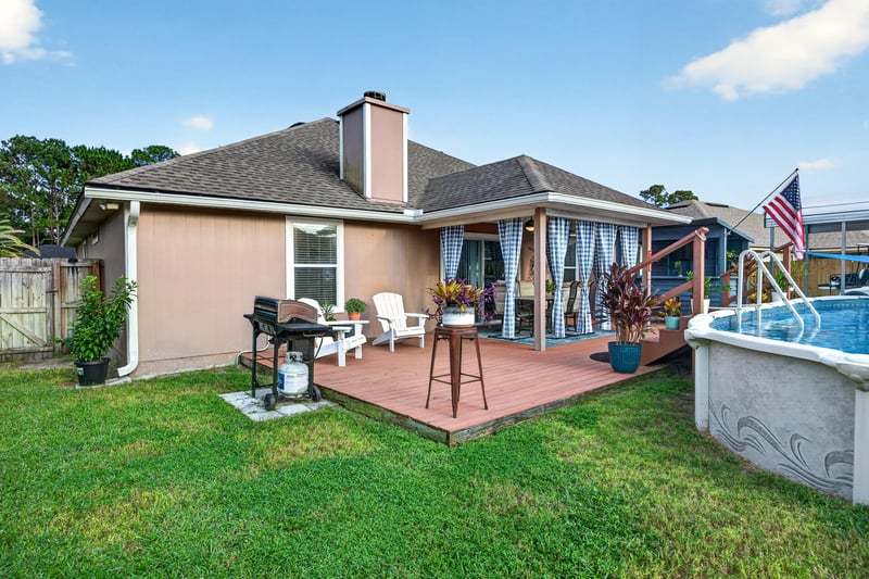 Backyard patio with grill and pool edge at 3112 Silverado Cir, Green Cove Springs, FL 32043