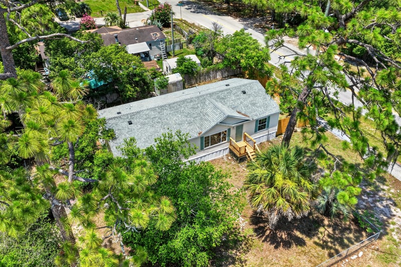 Aerial view of home roof and tree canopy at 7603 Coach Park Dr, Jacksonville, FL 32244