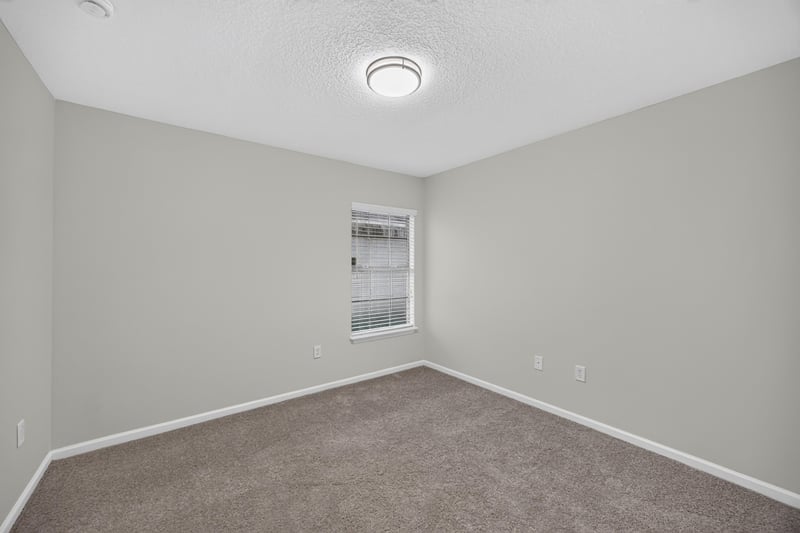 Empty carpeted room with window at 706 Bonaparte Dr, Jacksonville, FL 32218