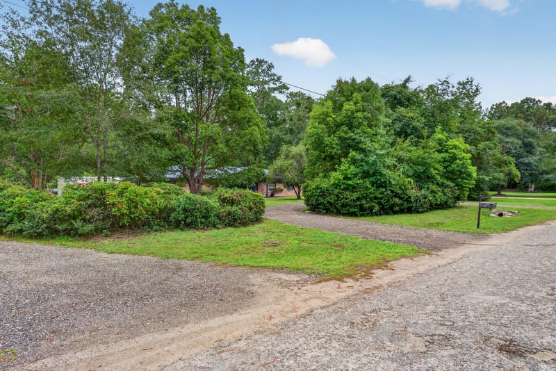 Gravel driveway path through the wooded property at 3249 Maryland Ave, Green Cove Springs, FL