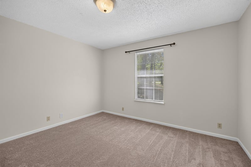 Bedroom with carpet and window at 2829 Blackberry Ave