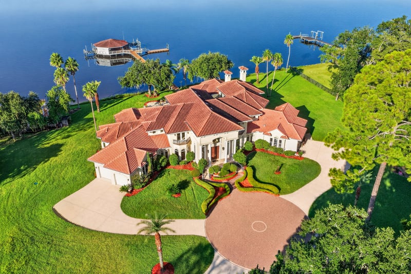 Aerial view of the home and dock along the water at 344 Broward Rd, Jacksonville, FL