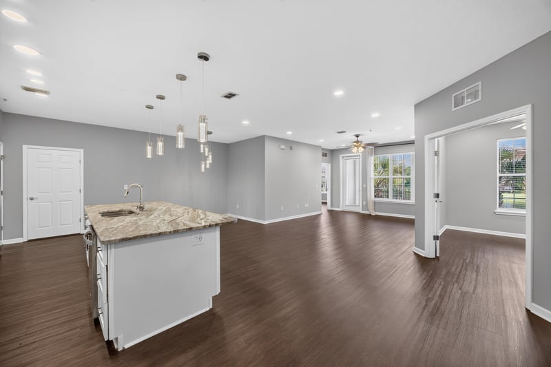 Kitchen island open to living room at 11251 Campfield Dr unit 4209, Jacksonville, FL 32256
