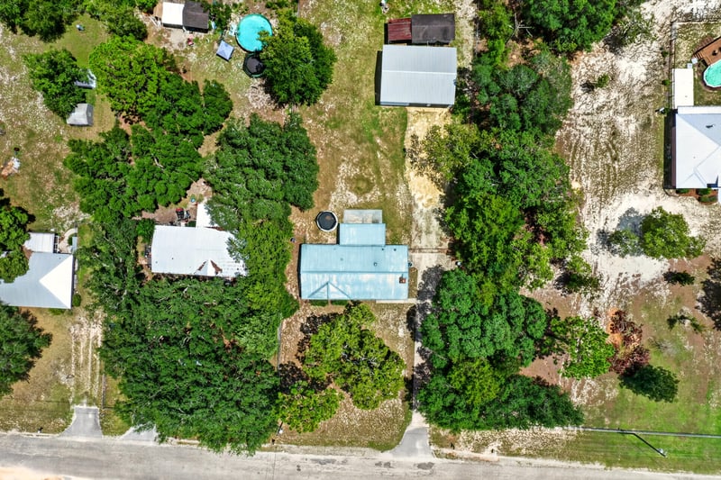 Aerial view of a pool and outbuildings in Keystone Heights, FL