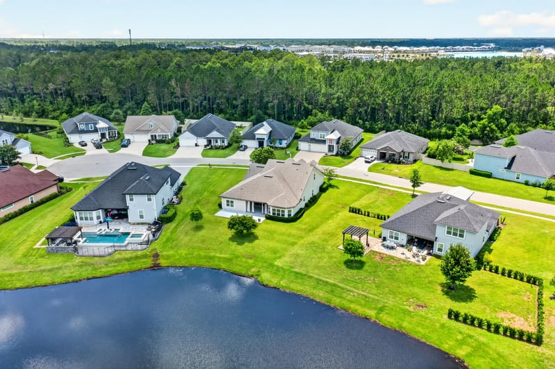 Aerial view of ponds and rooftops across the neighborhood in St. Augustine, FL