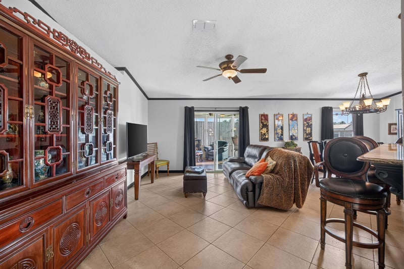 Living room with sectional sofa at 6931 Cane Grass Ln E, Jacksonville, FL 32244