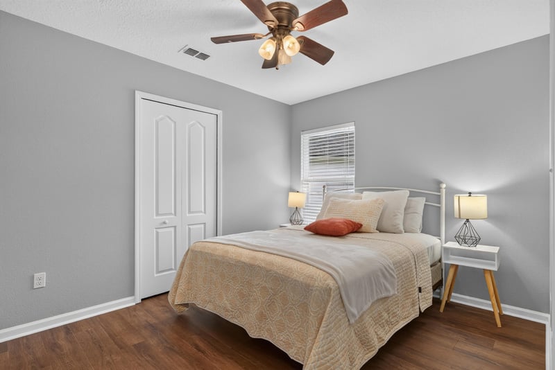Bedroom with staged bed at 706 Grampian Highlands Dr, St. Johns, FL 32259