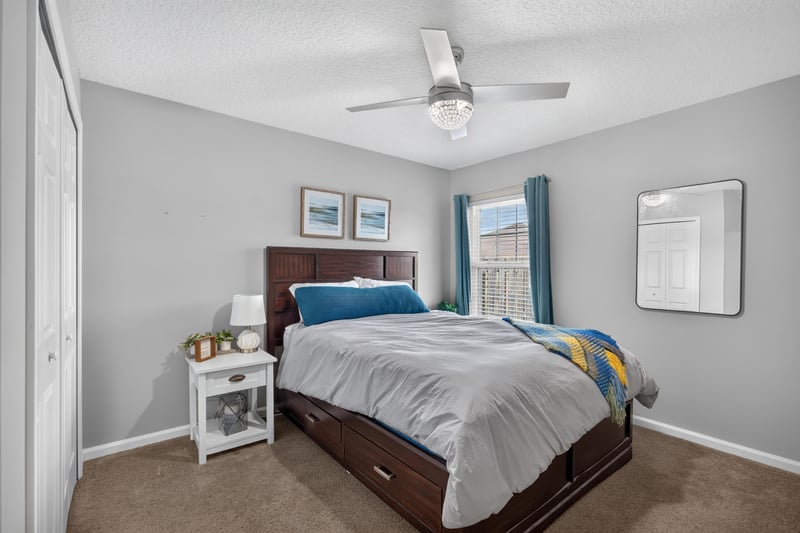 Bedroom with bed and wall art at 12825 Kelsey Island Dr, Jacksonville, FL 32224