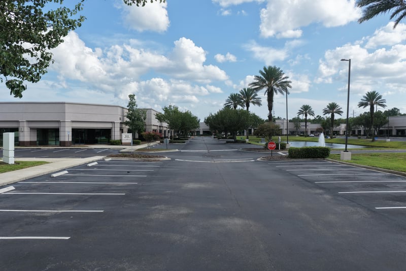 Palm-lined street through the parking area at 10550 Deerwood Park Blvd, Jacksonville, FL 32256