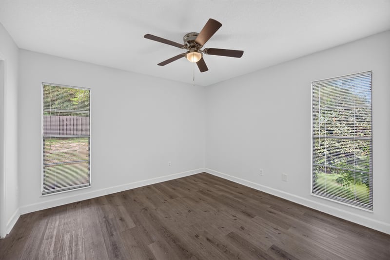 Bedroom with windows and wood floor at 551 Deltona Blvd, St. Augustine, FL 32086
