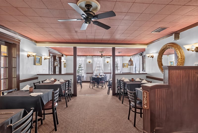 Dining room with wood beams and table seating at 115 Cordova St, St. Augustine, FL