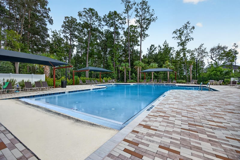 Community pool deck with covered seating in Middleburg, FL