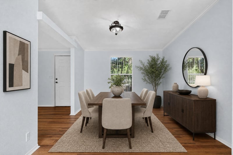 Dining area with virtually staged table and sideboard at 3215 Robin Ln, Middleburg, FL