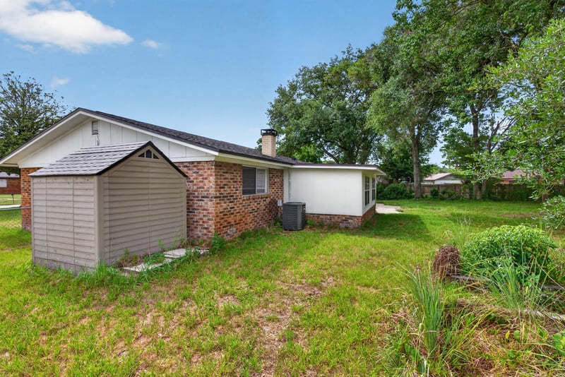 Side yard with storage shed at 9954 Larkdale Ct, Jacksonville, FL 32257