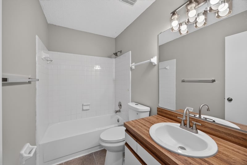 Bathroom with tub-shower combo and vanity at 3801 Crown Point Rd, Jacksonville, FL 32257