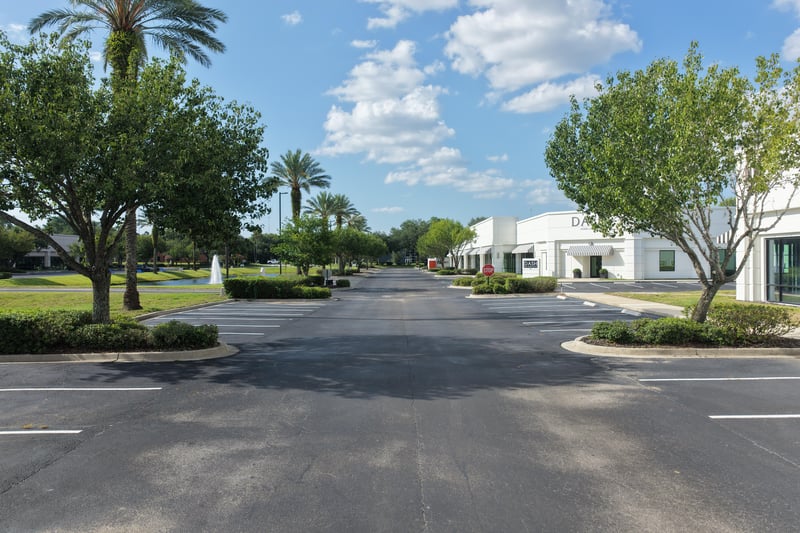 Tree-lined street leading through the parking area at 10550 Deerwood Park Blvd, Jacksonville, FL 32256
