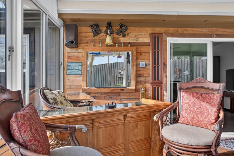 Sunroom with wood paneled wall at 6931 Cane Grass Ln E, Jacksonville, FL 32244