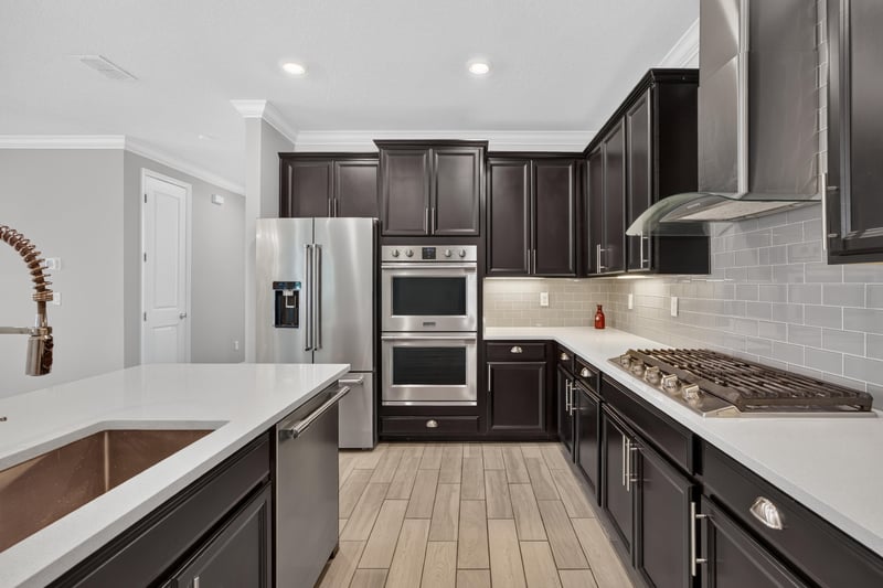 Kitchen with double wall ovens and gas cooktop at 91 Tilloo Ct, St. Johns, FL