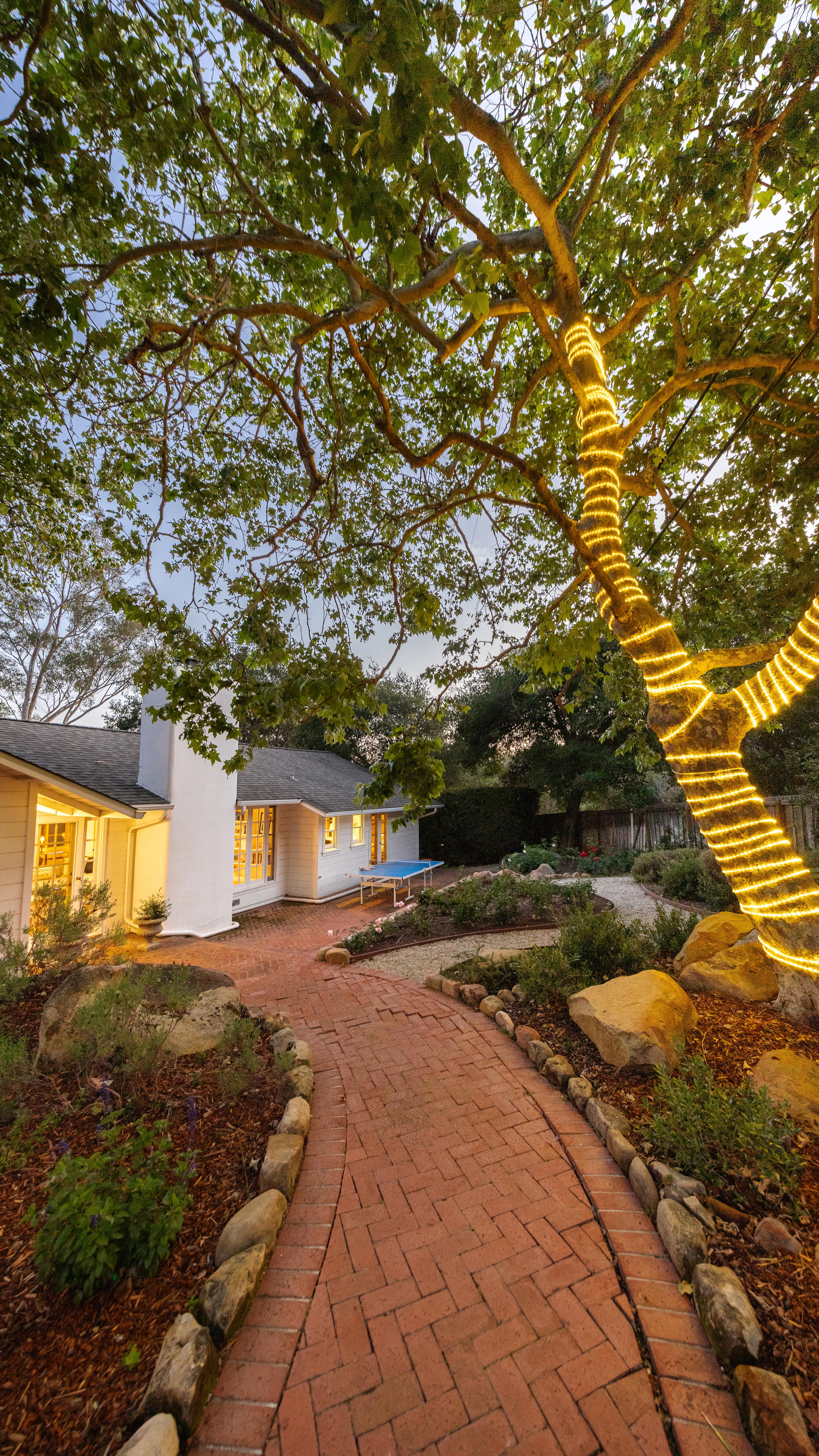 Twilight photography of luxury property at 2915 Hidden Valley Ln, Santa Barbara — deep blue dusk settles over the residence as interior warmth glows through the windows in this virtual tour photography series by VirTour Media, serving Carpinteria, Summerland, and the Carpinteria bluffs corridor. Our team captured still photography, aerial drone photography, and twilight photography from late afternoon through twilight.
