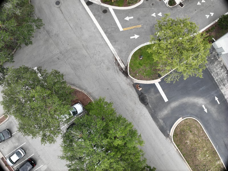 Aerial view of landscaped roundabout with oak tree at 9406 Atlantic Blvd, Jacksonville, FL 32225