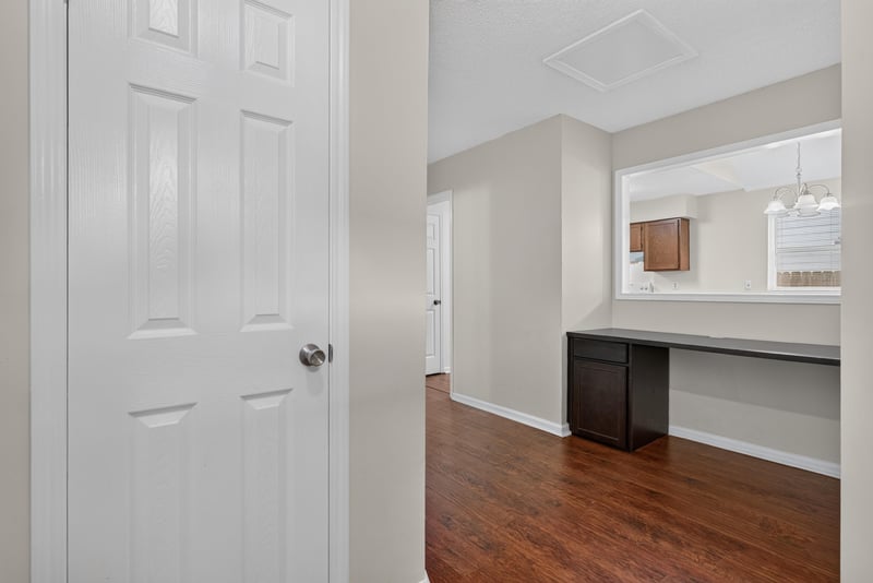 Hallway with built-in desk nook near entry at 4427 Millstone Ct, Jacksonville, FL