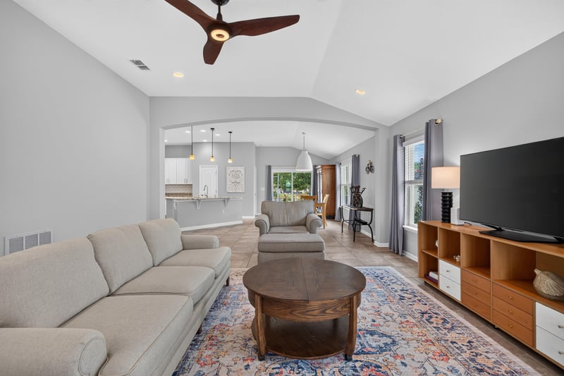Living room open to kitchen with tile floor at 85 Amia Dr, St. Augustine, FL 32086