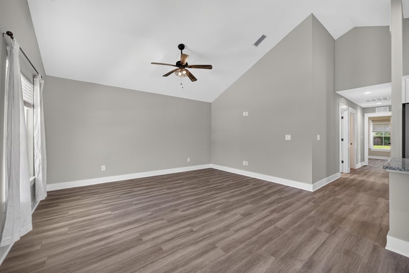 Living room with vaulted ceiling and hallway doors at 2855 N 8th St, St. Augustine, FL 32084