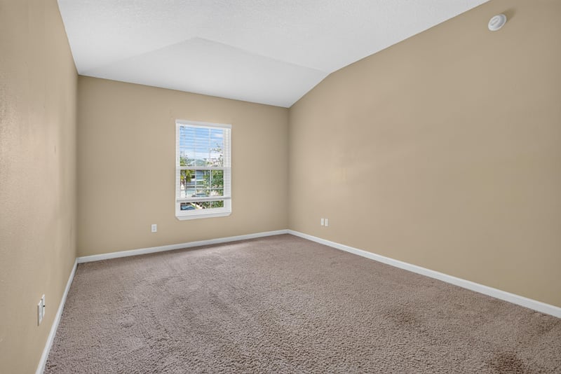 Bedroom with carpet and window at 12359 Mangrove Forest Ct, Jacksonville, FL 32218