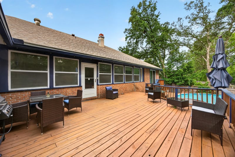 Rear exterior with screened porch and pool deck at 981 Marble Ridge Dr, Orange Park, FL 32065