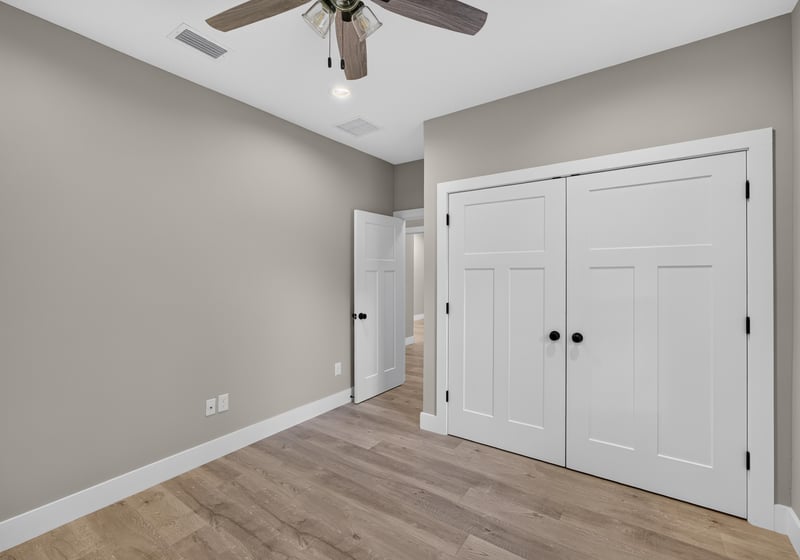 Bedroom with closet doors at 175 Alava Ct