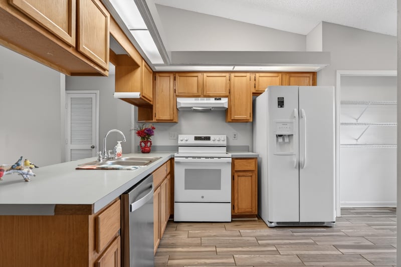 Kitchen with white appliances and countertop at 2164 Orangewood St, Middleburg, FL 32068